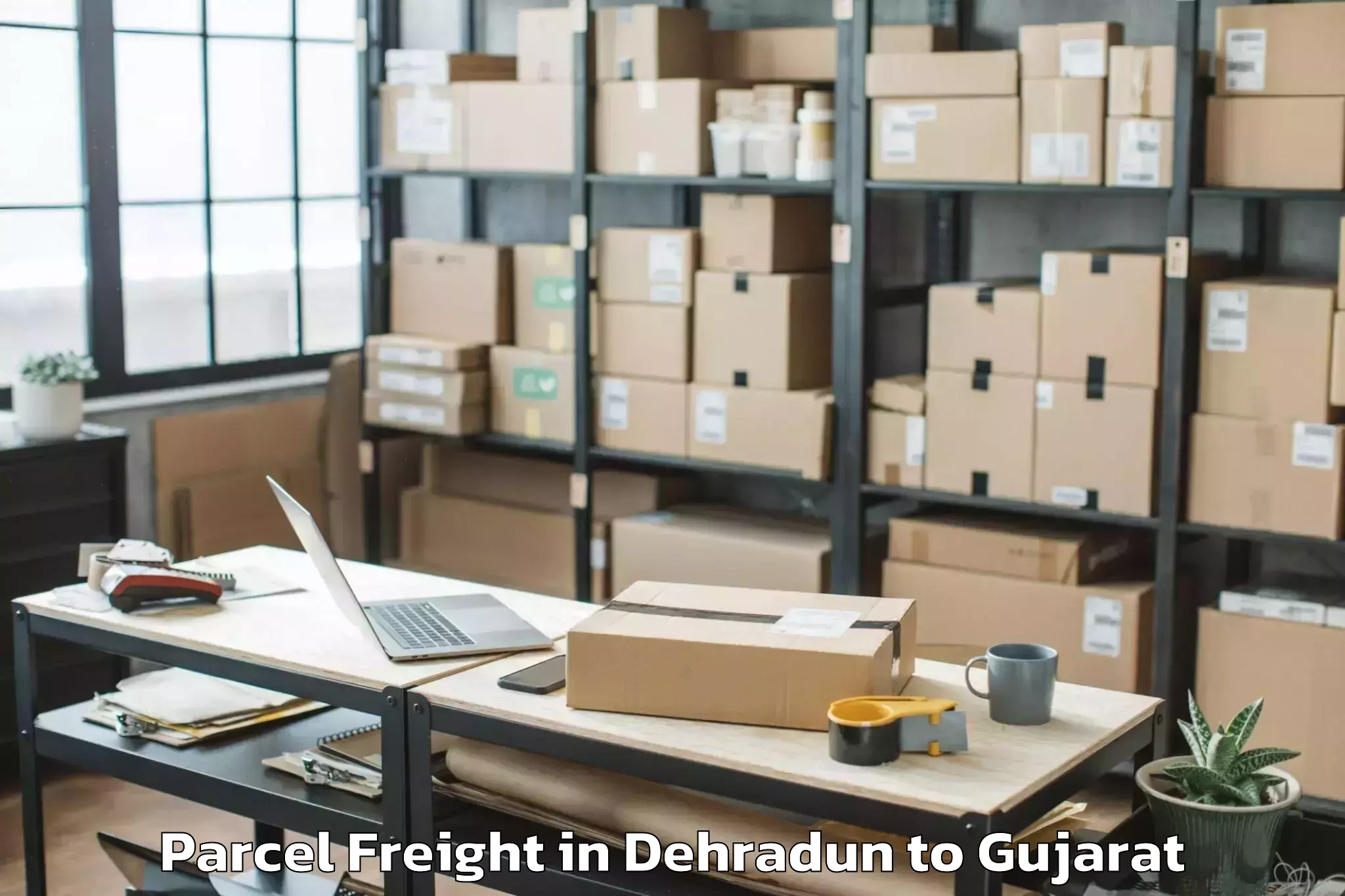 Book Dehradun to Vaghodia Ina Parcel Freight